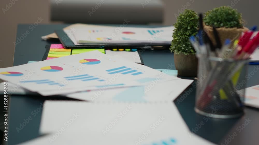 Aufkleber close up of data insights on papers in startup boardroom at night, charts and forecasting icons disp