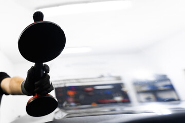 Windshield removal and installation using suction lifters. Windshield replacement using lifting...