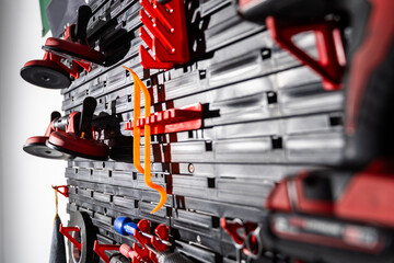 Tool Wall for Car Glass Work. Tool wall setup ideal for windshield removal and installation processes. Wall-mounted toolkit customized for auto glass replacement.