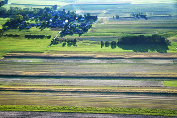 Aerial drone view of a vast patchwork of farmland in the Polish countryside, scenic rural landscape