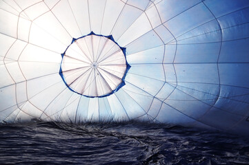Inside view of blue hot air balloon envelope during inflation