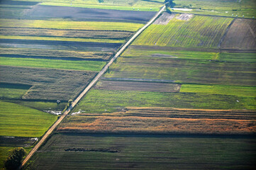 Aerial drone view of a vast patchwork of farmland in the Polish countryside, scenic rural landscape