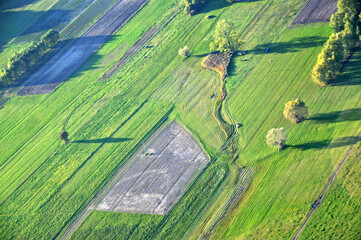Aerial drone view of a vast patchwork of farmland in the Polish countryside, scenic rural landscape
