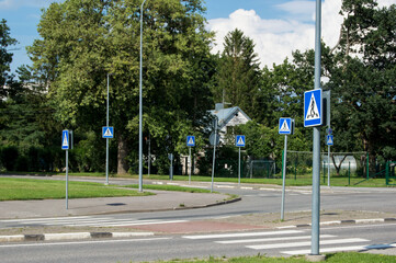many road signs pedestrian crossing