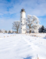 Winter scene with lighthouse