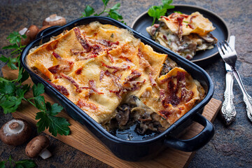 Artisan homemade traditional vincisgrassi marche pasta with mushrooms, prosciutto and bechamel...