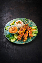 Sate Ayam- Grilled chicken satay sate skewers with peanut dipping spicy sauce, steamed rice and...