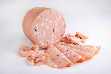 Traditional Italian artisan handcrafted fine mortadella with pistachio and truffle offered as close-up on white background with copy space – isolated © HLPhoto