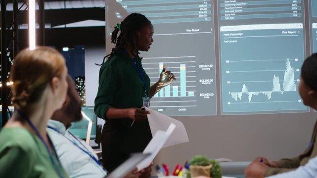 Business associates examining key performance indicators within the enterprise activity. Conducting evaluations and discuss updates to foster professional development, team efficiency. Camera B.
