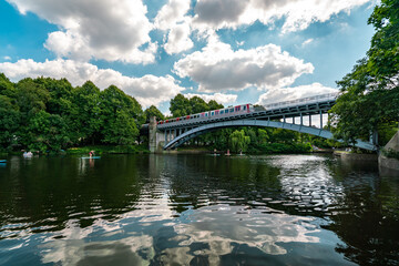 Fototapeta premium Summer in Hamburg: Reflective Waters Under a Bridge
