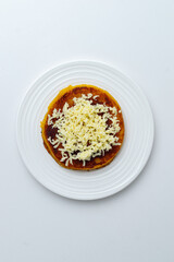 Sweet Corn Arepa with Fresh Cheese – Traditional Colombian Street Food on White Background