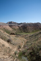Colorful eroded hills and green vegetation in Badlands National Park, South Dakota