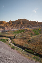 Eroded grassy hills and rock formations in Badlands National Park, South Dakota