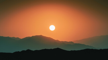 Majestic sunset over serene mountain silhouette