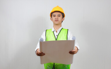 Asian construction worker holding blueprint in hand looking seriously isolated on white background.Concept Engineer and business work. Success.