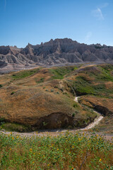 Eroded grassy hills and rock formations in Badlands National Park, South Dakota