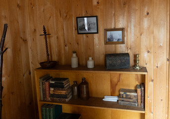 Bookshelf with vintage objects in historic Canadian pioneer home, Edmonton, Alberta