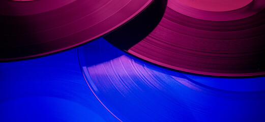 Musical color background with vinyl records. close-up of vinyl discs with texture for music banner...