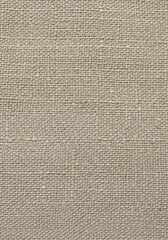 Fototapeta premium Detailed close-up of textured burlap fabric showcasing its intricate weave pattern and earthy tone