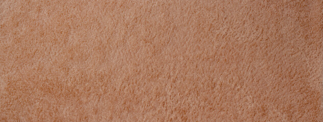 ふわふわの肌触りの茶色い布地の背景テクスチャー