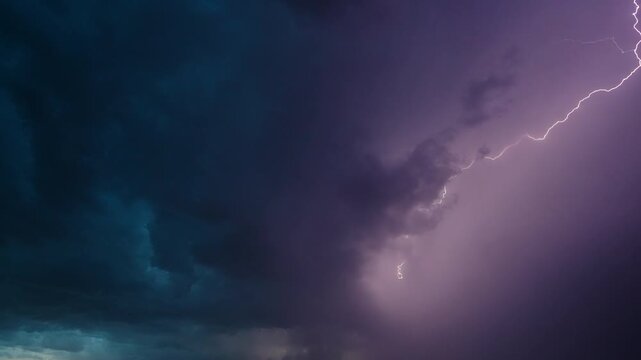 Clouds of severe weather above with bright lightning bolts flashing 