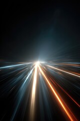 Fast-moving light trails on a dark road