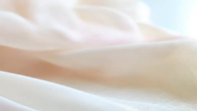 Close-up of draped pink and white sheer fabrics.