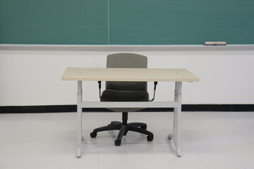 Modern office desk with a green chalk board.