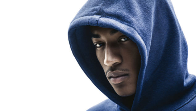 Intense young man in blue hoodie looking mysterious portrait