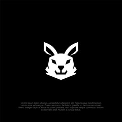 Minimalist white bunny head logo on black backdrop, a versatile icon for brands aiming for simplicity and elegance in their visual identity and logo vector art concept