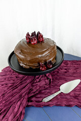 Dark chocolate fudge cake with candied roselle hibiscus calyxes on top
