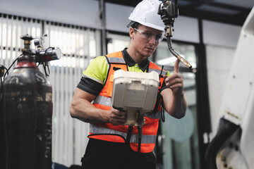 Smart Caucasian engineer work setup AI automated in robotics electronics engineering laboratory....