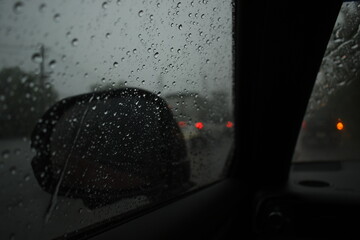 car on highway road in the night with heavy rainny season, blurred image