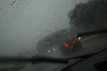 car on highway road in the night with heavy rainny season, blurred image