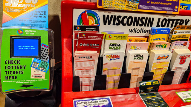 A display for the Wisconsin Lottery at a retail establishment, showcasing different games available, including Powerball and Mega Millions on August 3, 2025. For Editorial Use Only.