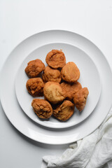 Overhead view of Akara on a white plate, top view of Brazilian acaraje fried beans cake on a plate