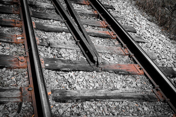 macro close-up of railroad tracks with isolated color. vintage aesthetic with texture detail and...
