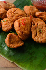 Overhead view of Akara on a leaf, top view of Brazilian acaraje fried beans cake on a platter