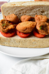Akara and bread on a white plate, nigerian akara fried beans cake and bread on a plate