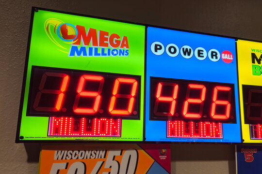A lottery sign in Wisconsin showing jackpot amounts for two popular multi-state lottery games, Mega Millions and Powerball (August 3, 2025).  Editorial Use Only.