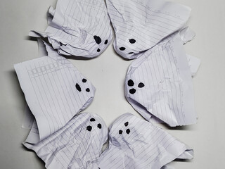 A charming circle of handmade crumpled paper ghosts, a simple and fun DIY Halloween craft idea.