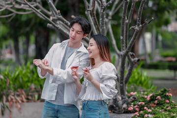 Asian Couple Enjoying Red Wine Together