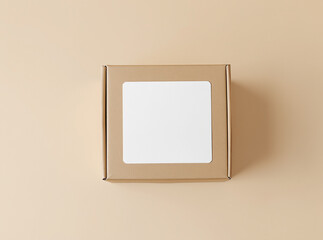 Cardboard box with blank label mockup on beige background