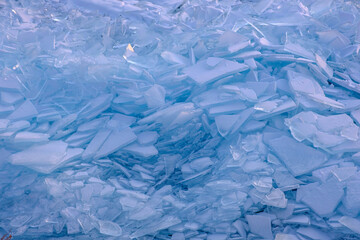 Endless hummock field on frozen Lake Baikal. Piles of snow-covered debris of blue ice on frosty day