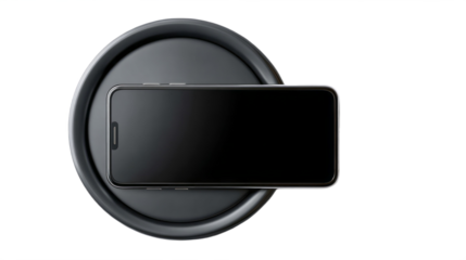 Sleek matte black wireless charging pad with smartphone placed isolated, transparent background