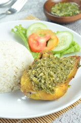Green chili smashed fried chicken is a common and popular dish in Indonesia.
