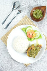 Green chili smashed fried chicken is a common and popular dish in Indonesia.