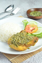 Green chili smashed fried chicken is a common and popular dish in Indonesia.