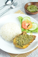 Green chili smashed fried chicken is a common and popular dish in Indonesia.