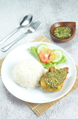 Green chili smashed fried chicken is a common and popular dish in Indonesia.